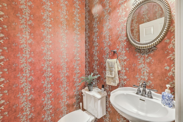 bathroom with sink and toilet