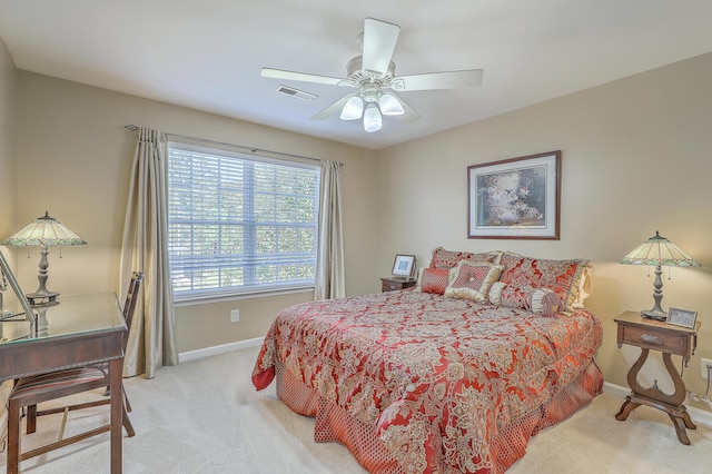 bedroom featuring light colored carpet and ceiling fan