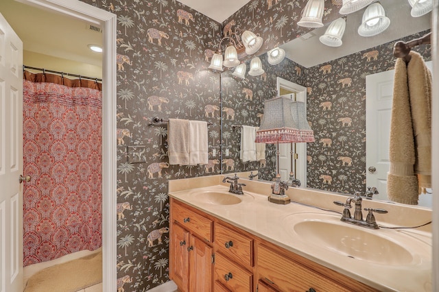 bathroom with vanity and a shower with shower curtain