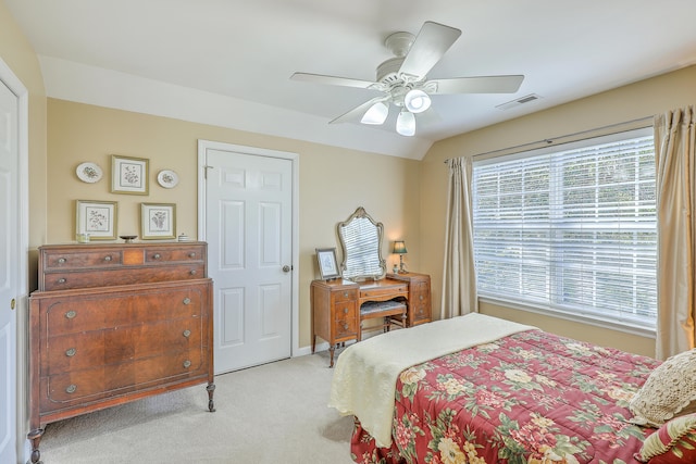 carpeted bedroom with lofted ceiling and ceiling fan