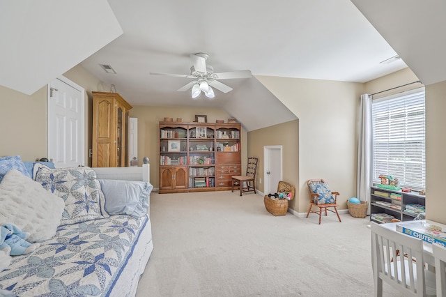 living room featuring ceiling fan, light carpet, and vaulted ceiling