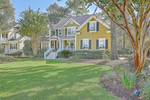 view of front of house featuring a front yard and covered porch