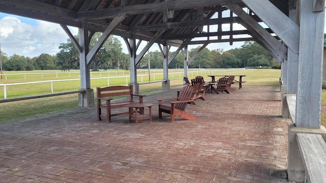 surrounding community featuring a patio, a gazebo, and a lawn