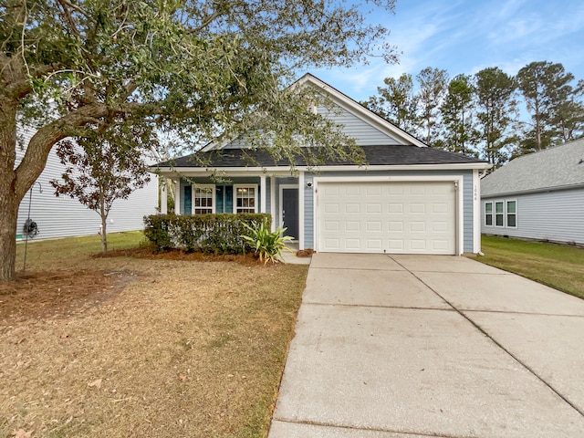 view of front facade with a garage and a front lawn