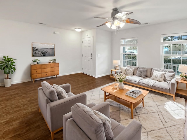 living room featuring hardwood / wood-style floors and ceiling fan