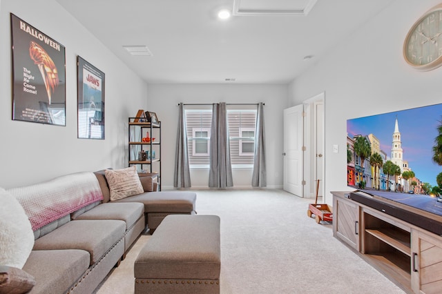 carpeted living area with healthy amount of natural light