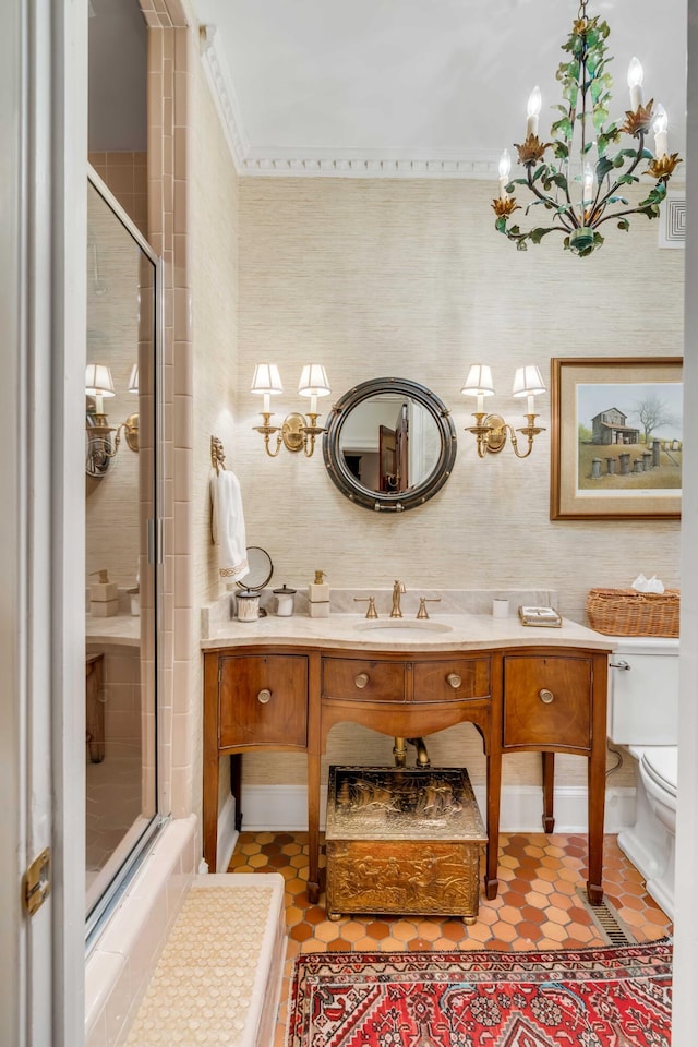 bathroom with vanity, an inviting chandelier, tile patterned floors, toilet, and a shower with shower door