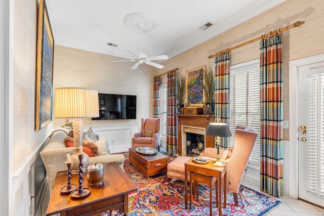 living room featuring light tile patterned floors and ceiling fan