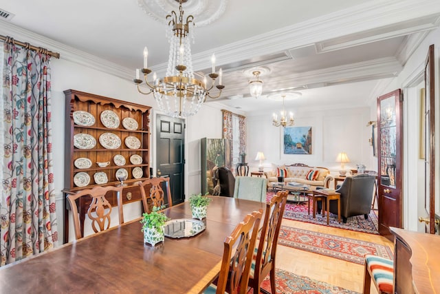 dining room with crown molding, parquet floors, and a notable chandelier