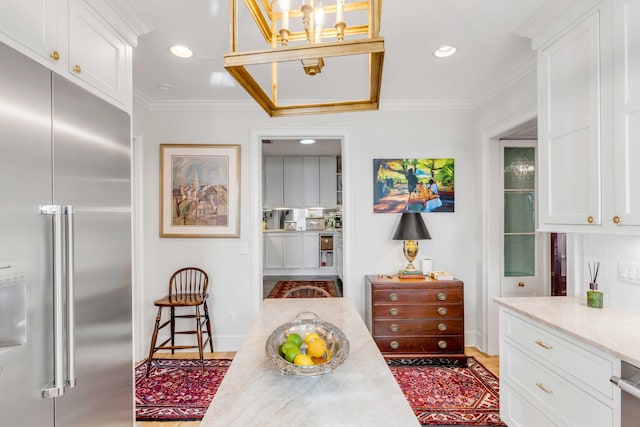 interior space featuring hardwood / wood-style flooring and crown molding