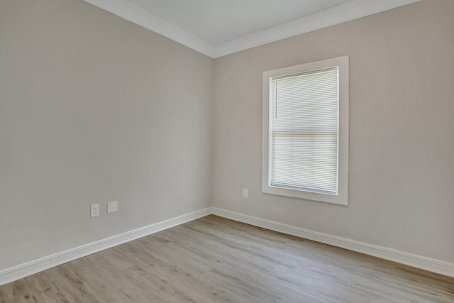 unfurnished room featuring light hardwood / wood-style floors and ornamental molding