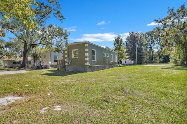 1910 Kerry St, North Charleston, SC 29406 - view of side of property with a yard
