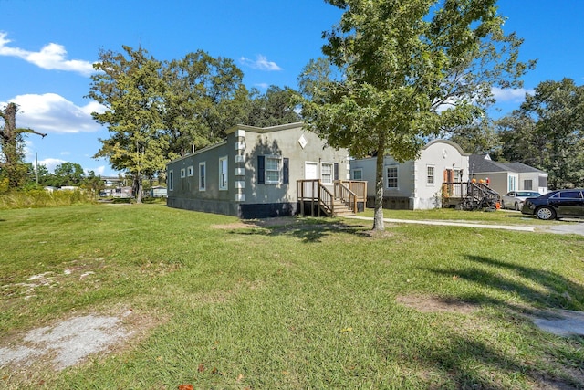 1910 Kerry St, North Charleston, SC 29406 - view of front facade with a front lawn