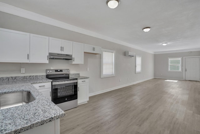 1910 Kerry St, North Charleston, SC 29406 - kitchen with stainless steel electric range, a wall mounted AC, under cabinet range hood, crown molding, and white cabinetry
