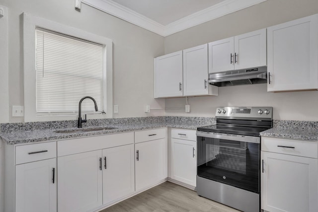 1910 Kerry St, North Charleston, SC 29406 - kitchen featuring under cabinet range hood, stainless steel electric range oven, a sink, crown molding, and white cabinets