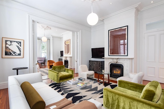 155 Wentworth St Unit A, Charleston, SC 29401 - living room with baseboards, ornamental molding, wood finished floors, and a premium fireplace