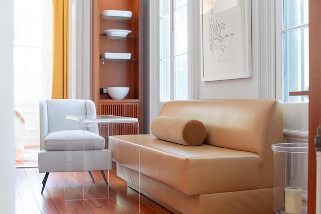 155 Wentworth St Unit A, Charleston, SC 29401 - sitting room featuring built in shelves and wood finished floors
