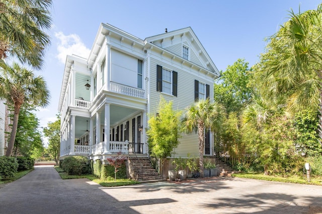 155 Wentworth St Unit A, Charleston, SC 29401 - view of front of property featuring a porch, ceiling fan, a balcony, and stairway