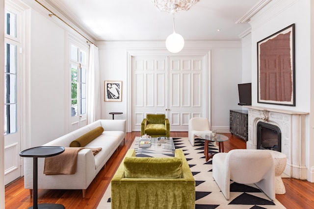 155 Wentworth St Unit A, Charleston, SC 29401 - living room with ornamental molding, a fireplace, and wood finished floors
