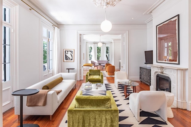 155 Wentworth St Unit A, Charleston, SC 29401 - living room featuring a notable chandelier, ornamental molding, wood finished floors, and a high end fireplace