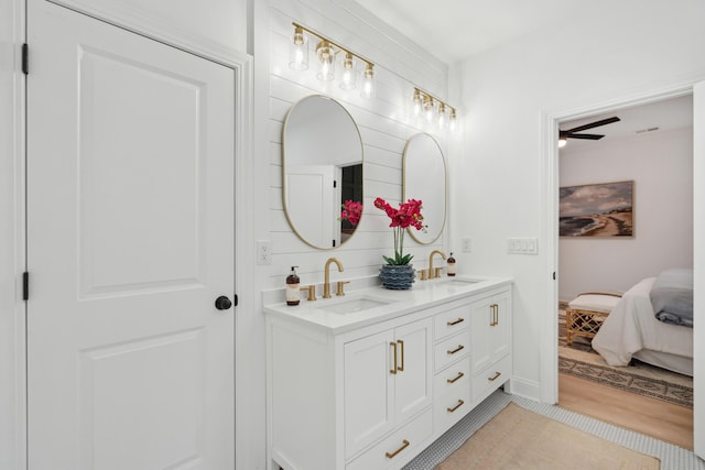 bathroom featuring tile patterned flooring and vanity