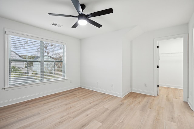 empty room featuring ceiling fan and light wood-type flooring