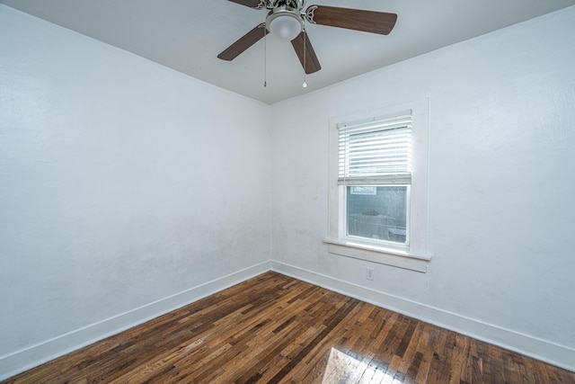 unfurnished room featuring dark hardwood / wood-style floors and ceiling fan