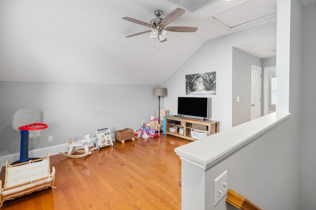 rec room featuring lofted ceiling, ceiling fan, and wood-type flooring