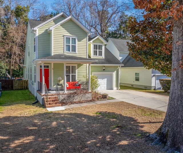 view of front of home with covered porch and a garage