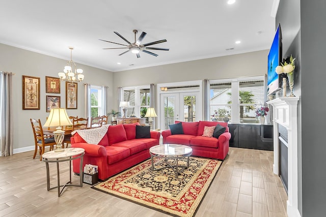 3115 Cross Vine Ln, Summerville, SC 29483 - living room with light wood finished floors, recessed lighting, french doors, and crown molding