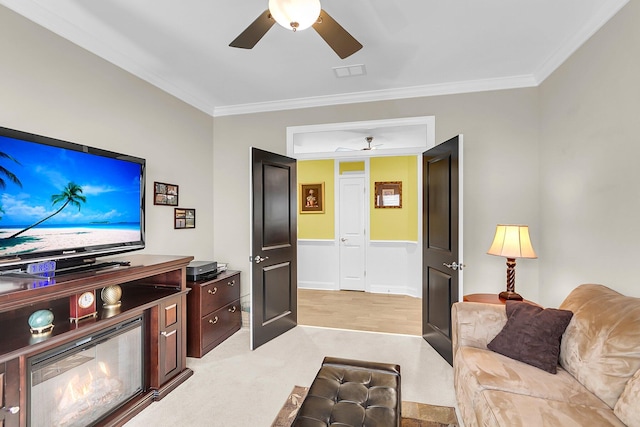 3115 Cross Vine Ln, Summerville, SC 29483 - living area with light carpet, a ceiling fan, visible vents, and ornamental molding
