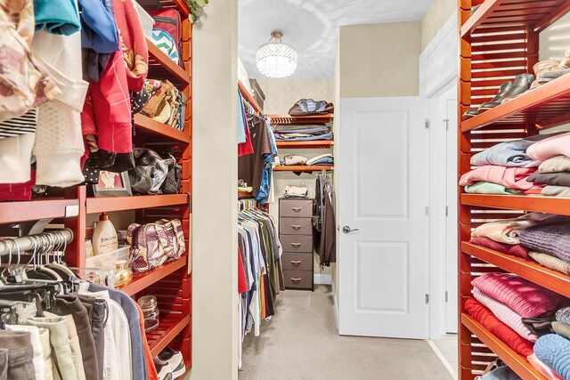 3115 Cross Vine Ln, Summerville, SC 29483 - walk in closet featuring an inviting chandelier