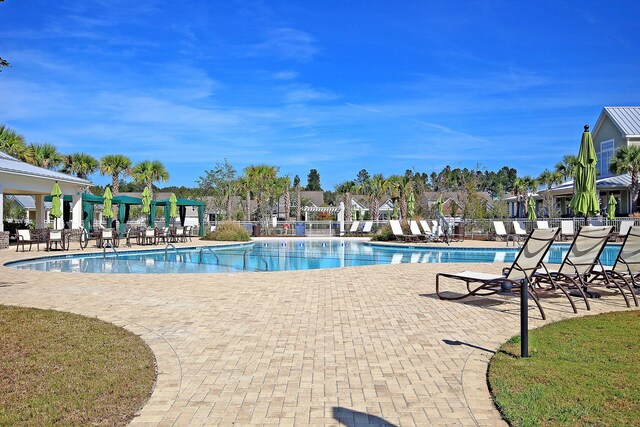 3115 Cross Vine Ln, Summerville, SC 29483 - community pool with a patio and fence