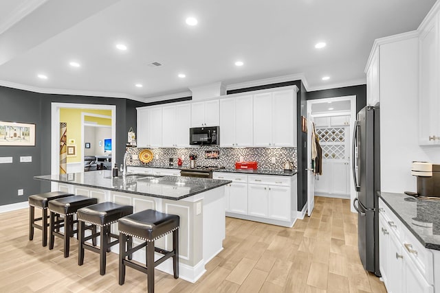 3115 Cross Vine Ln, Summerville, SC 29483 - kitchen featuring decorative backsplash, visible vents, appliances with stainless steel finishes, and a sink
