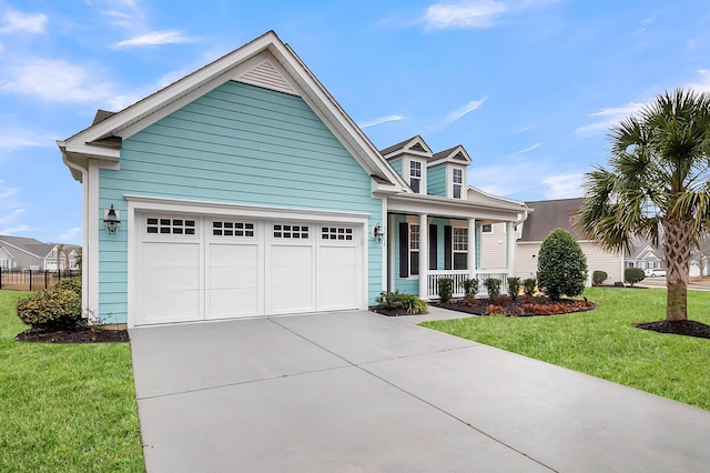 3115 Cross Vine Ln, Summerville, SC 29483 - cape cod house featuring a front lawn, concrete driveway, covered porch, and an attached garage