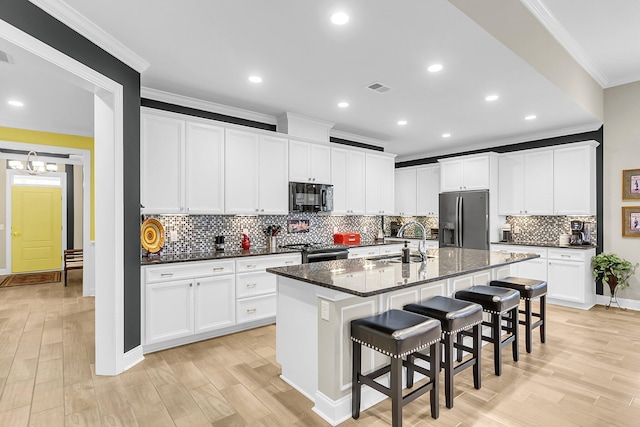 3115 Cross Vine Ln, Summerville, SC 29483 - kitchen with visible vents, black microwave, fridge with ice dispenser, electric range, and a sink