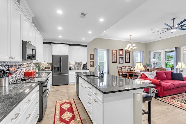 3115 Cross Vine Ln, Summerville, SC 29483 - kitchen featuring a breakfast bar area, ornamental molding, decorative backsplash, appliances with stainless steel finishes, and a sink