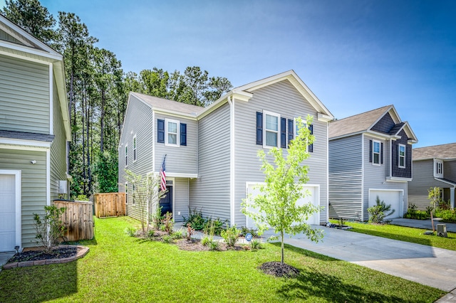 view of front of house featuring a garage and a front yard