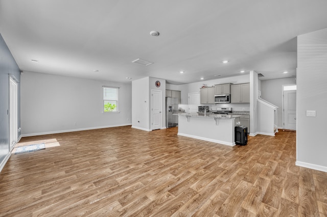 unfurnished living room with light hardwood / wood-style floors