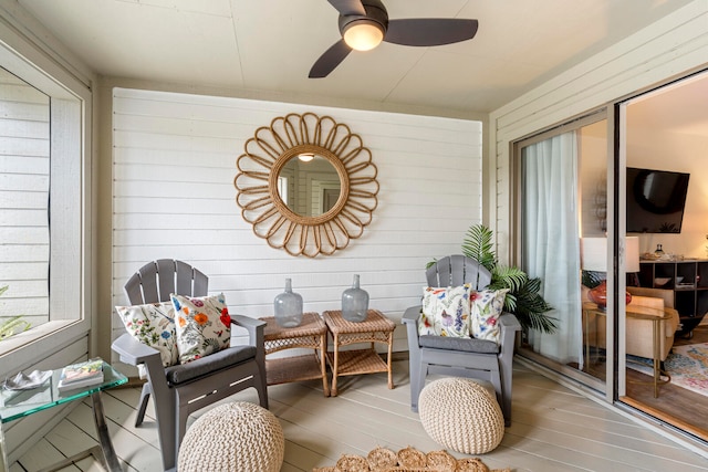 sunroom / solarium with ceiling fan