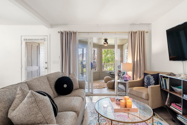 living room featuring hardwood / wood-style floors and beam ceiling