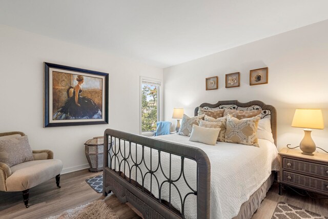 bedroom with wood-type flooring