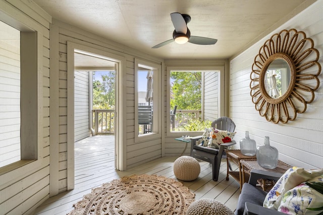 1647 Live Oak Park, Seabrook Island, SC 29455 - sunroom featuring wood-type flooring, wooden walls, and a wooden deck