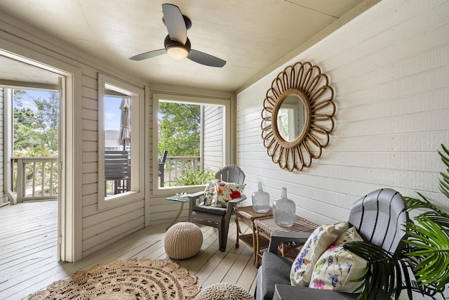1647 Live Oak Park, Seabrook Island, SC 29455 - sunroom / solarium with hardwood / wood-style flooring, healthy amount of natural light, a ceiling fan, and wood walls