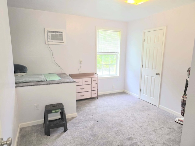 9489 Sidneys Rd, Round O, SC 29474 - interior space featuring an AC wall unit, carpet flooring, and baseboards