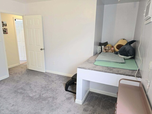 9489 Sidneys Rd, Round O, SC 29474 - carpeted bedroom with baseboards and a wall unit AC