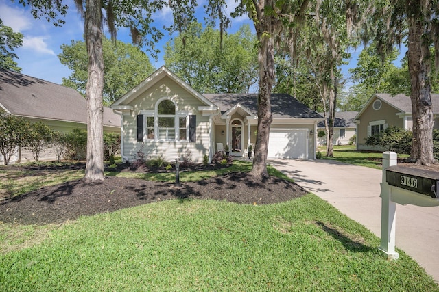 ranch-style home featuring driveway, a garage, and a front lawn