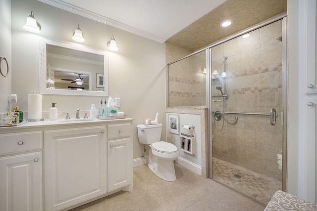 full bathroom with a shower stall, crown molding, vanity, and toilet