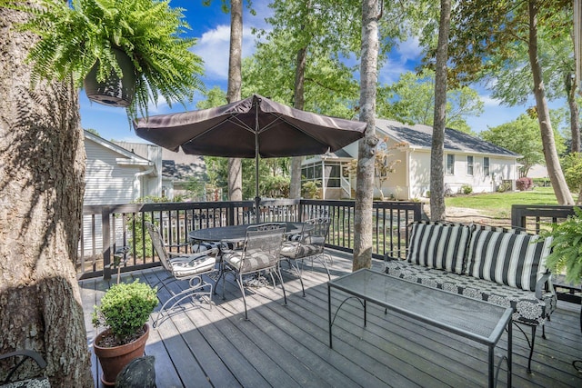 deck featuring outdoor dining area