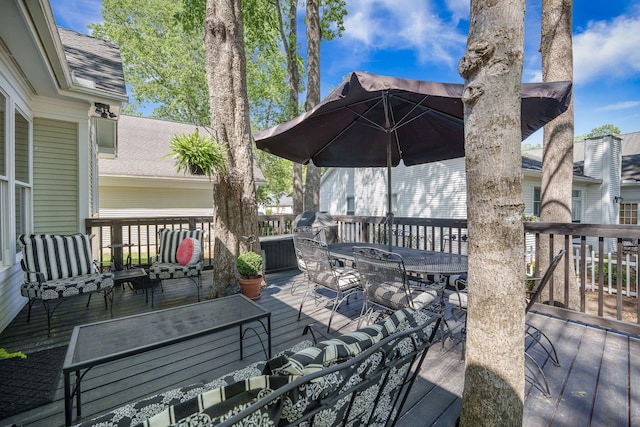 wooden deck with outdoor dining space